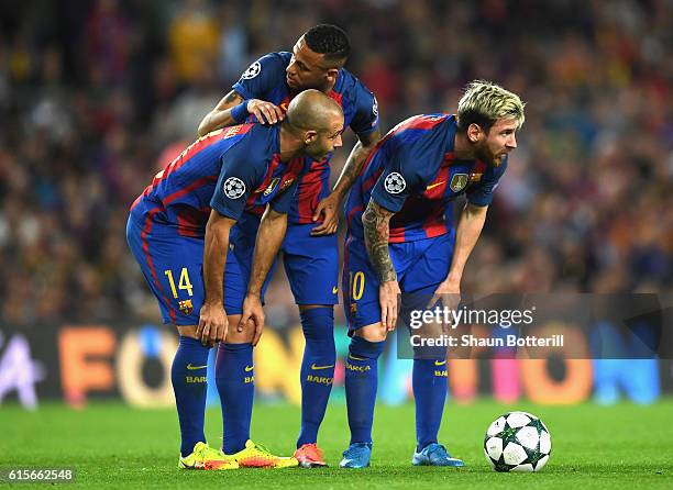 Javier Mascherano , Neymar and Lionel Messi of Barcelona stand over a free kick during the UEFA Champions League group C match between FC Barcelona...