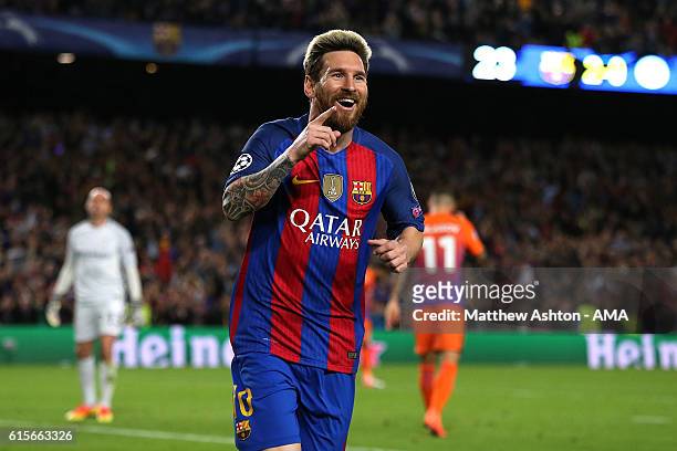 Lionel Messi of Barcelona celebrates scoring his team's third goal to seal his hat-trick and make the score 3-0 during the UEFA Champions League...