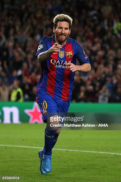 Lionel Messi of Barcelona celebrates scoring his team's third goal to seal his hat-trick and make the score 3-0 during the UEFA Champions League...