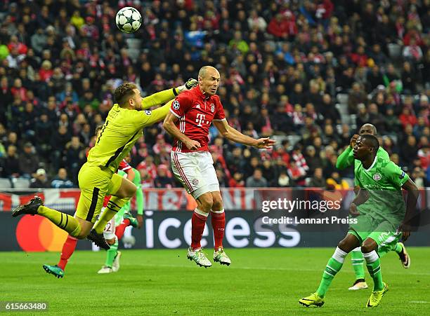 Arjen Robben of FC Bayern Muenchen scores his team's fourth goal against Jeroen Zoet of PSV Eindhoven during the UEFA Champions League match between...