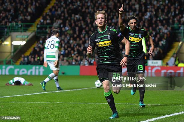 Andre Hahn of Borussia Moenchengladbach celebrates after scoring his team's second goal of the game during the UEFA Champions League group C match...