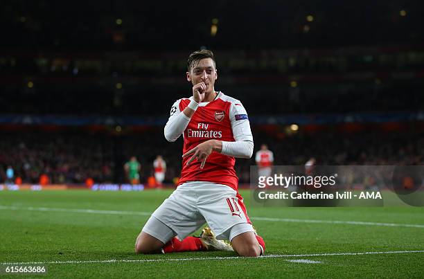Mesut Ozil of Arsenal celebrates after scoring to make it 5-0 during the UEFA Champions League match between Arsenal FC and PFC Ludogorets Razgrad at...