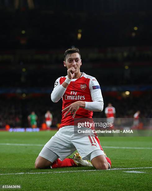 Mesut Ozil of Arsenal celebrates after scoring to make it 5-0 during the UEFA Champions League match between Arsenal FC and PFC Ludogorets Razgrad at...