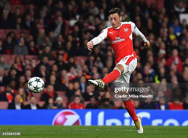 Mesut Ozil of Arsenal scores his team's sixth goal of the game during the UEFA Champions League group A match between Arsenal FC and PFC Ludogorets...