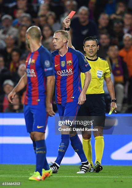 Jeremy Mathieu of Barcelona is sent off by referee Milorad Maic during the UEFA Champions League group C match between FC Barcelona and Manchester...
