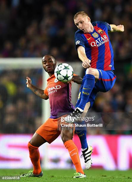 Jeremy Mathieu of Barcelona controls the ball under pressure from Raheem Sterling of Manchester City during the UEFA Champions League group C match...
