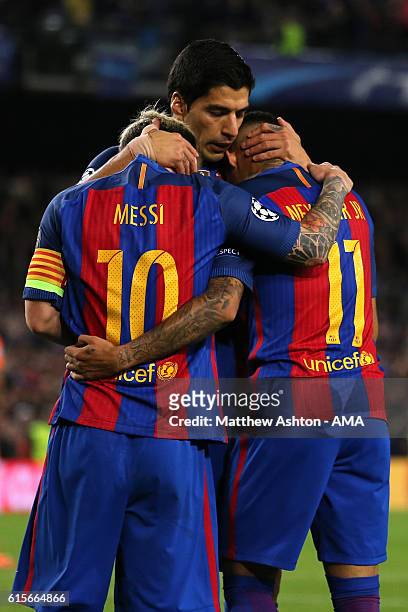 Neymar of Barcelona celebrates scoring his team's fourth goal to make the score 4-0 with team-mates Lionel Messi and Luis Suarez during the UEFA...