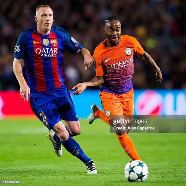 Jeremy Mathieu of FC Barcelona fights for the ball with Raheem Sterling of Manchester City FC during the UEFA Champions League group C match between...