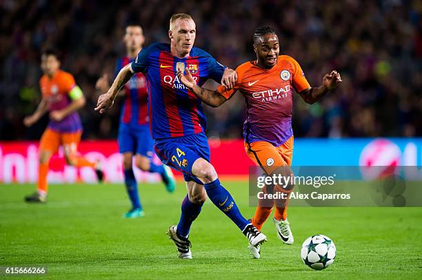 Jeremy Mathieu of FC Barcelona fights for the ball with Raheem Sterling of Manchester City FC during the UEFA Champions League group C match between...