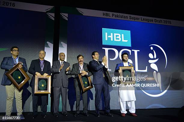 Pakistan Super League chairman Najam Sethi poses with team owners during second edition of PSL draft in Dubai on October 19, 2016. Pakistan's...