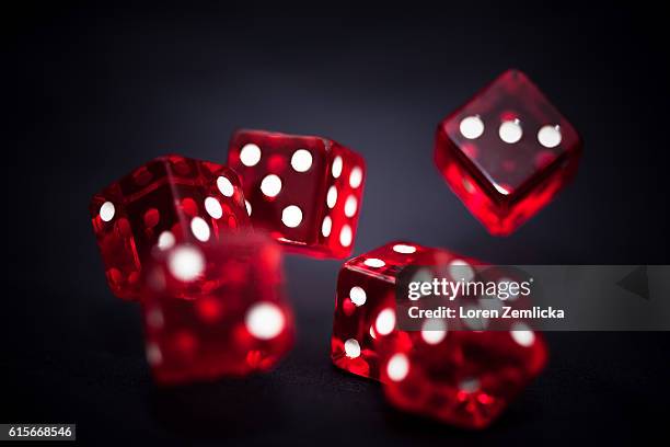 rolling dice - casino dice stock pictures, royalty-free photos & images