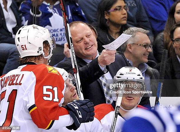 Toronto, ON, Canada: Florida Panthers head coach Gerrard Gallant gestures as he speaks to defenceman Brian Campbell during a break in play against...