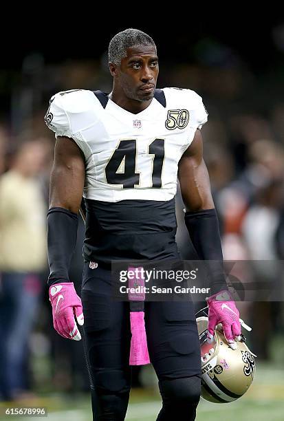 Roman Harper of the New Orleans Saints warms up before his team takes on the Carolina Panthers at the Mercedes-Benz Superdome on October 16, 2016 in...