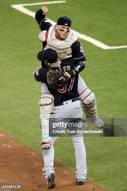 Cody Allen and Roberto Perez of the Cleveland Indians celebrate after defeating the Toronto Blue Jays with a score of 3 to 0 in game five of the...