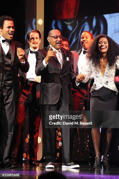 Four Tops member Duke Fakir poses with cast members of the West End production of "Motown The Musical" at The Shaftesbury Theatre on October 19, 2016...