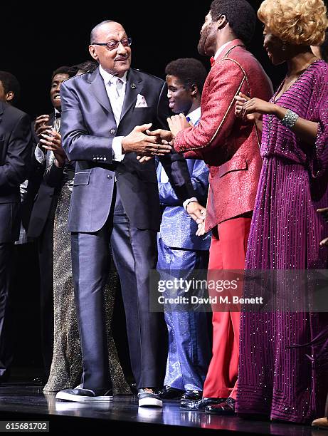 Four Tops member Duke Fakir poses with cast members of the West End production of "Motown The Musical" at The Shaftesbury Theatre on October 19, 2016...