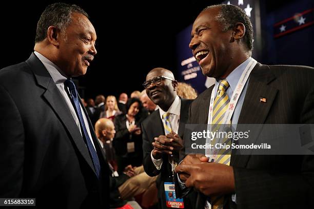 Former presidential candidate, Dr. Ben Carson speaks with Jesse Jackason before the start of the third U.S. Presidential debate at the Thomas & Mack...