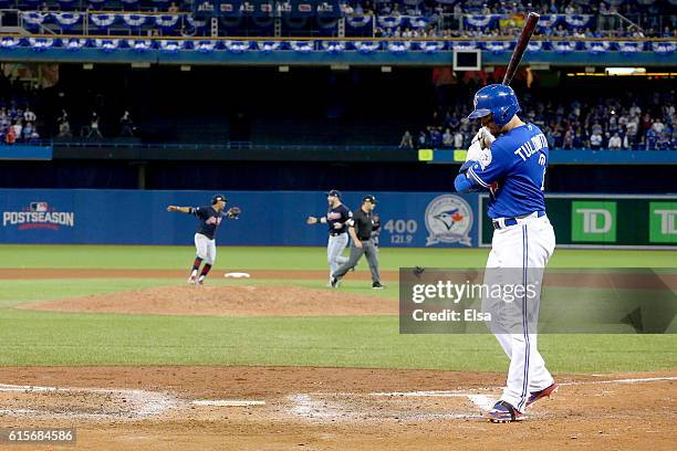 Francisco Lindor and Jason Kipnis of the Cleveland Indians celebrate as Troy Tulowitzki of the Toronto Blue Jays reacts after a pop up foul out to...