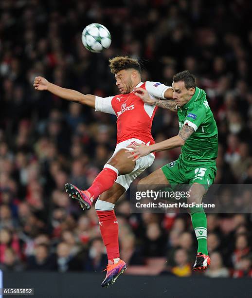 Alex Oxlade-Chamberlain of Arsenal outjumps Yordan Minev of Ludogorets during the UEFA Champions League match between Arsenal FC and PFC Ludogorets...