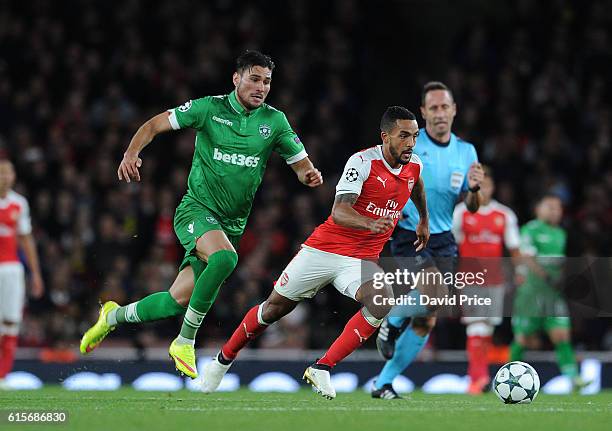 Theo Walcott of Arsenal takes on Jose Luis Palomino of Ludogerets during the UEFA Champions League match between Arsenal FC and PFC Ludogorets...