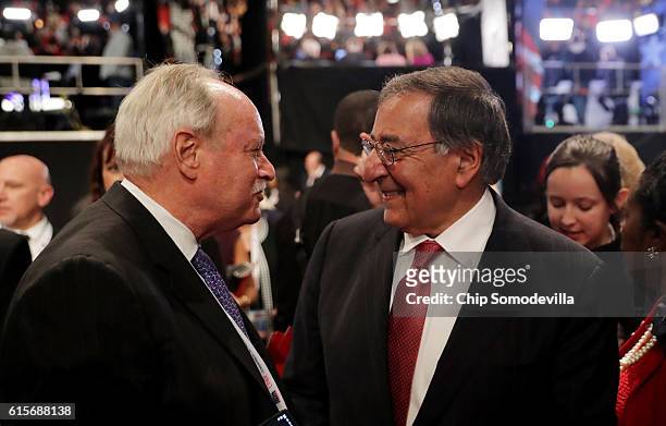 Former Secretary of Defense Leon Panetta speaks with guests prior to the start of the third U.S. Presidential debate at the Thomas & Mack Center on...