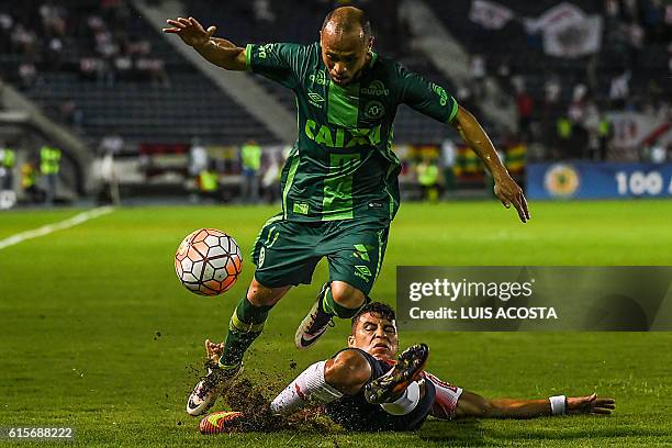 Colombia's Junior footballer Alexis Perez vies for the ball with Brazil's Chapecoense player Ananias, during their Copa Sudamericana football match...