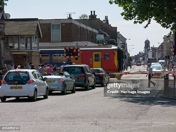 Train passing through level crossing in Lincoln 2014. Artist Unknown.