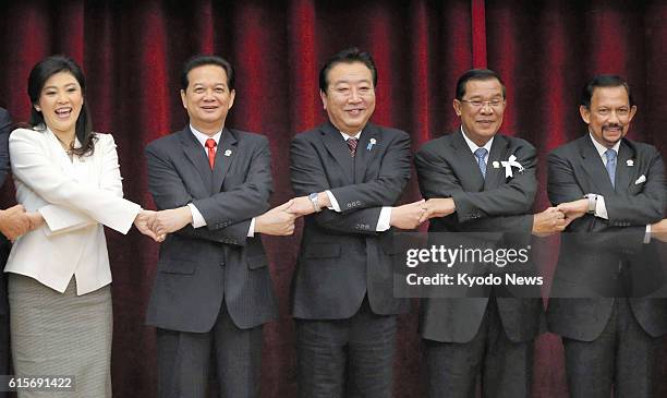 Cambodia - Leaders join hands at the summit meeting of Japan and the Association of Southeast Asian Nations in Phnom Penh on Nov. 18, 2012. Shown are...