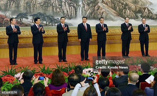 China - Seven members of the new Politburo Standing Committee of the Communist Party of China line up on the stage at the Great Hall of the People in...