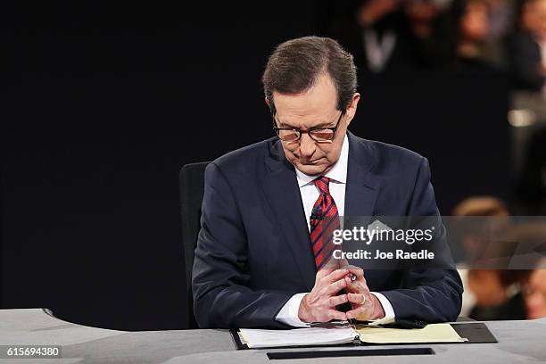 Fox News anchor and moderator Chris Wallace waits for the start of the third U.S. Presidential debate at the Thomas & Mack Center on October 19, 2016...