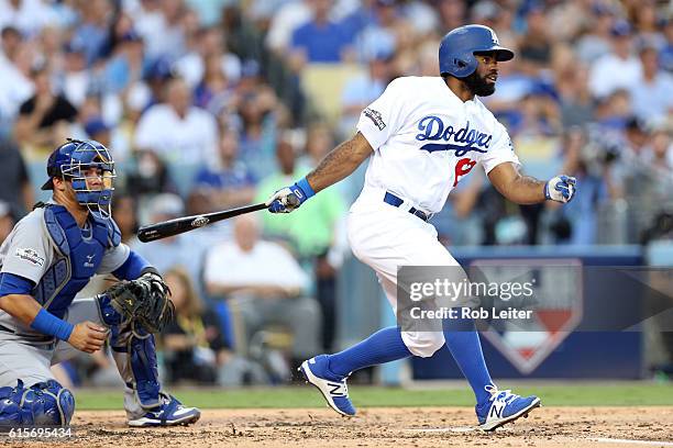 Andrew Toles of the Los Angeles Dodgers singles in the second inning during Game 4 of the NLCS against the Chicago Cubs at Dodger Stadium on...