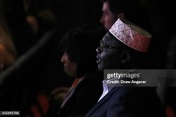 Malik Obama, President Barack Obama's Kenyan-born half-brother, listens to the candidates speak during the third U.S. Presidential debate at the...