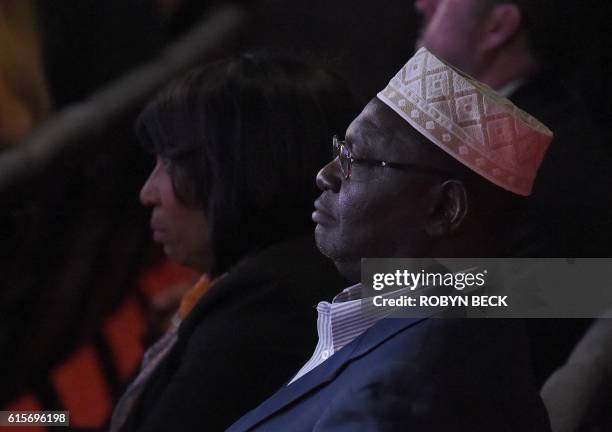 The half brother of US President Barack Obama, Malik Obama, watches the final presidential debate at the Thomas & Mack Center on the campus of the...