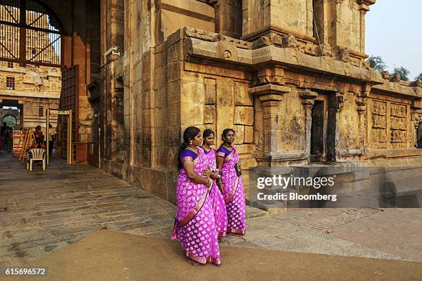 Devotees exit the Brihadeshwara Temple in Thanjavur, Tamil Nadu, India, on Sunday, Oct. 16, 2016. India's new central bank head seems to be doing his...