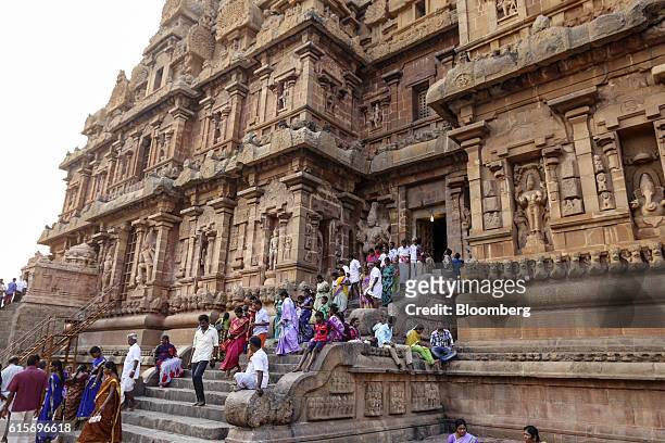 Devotees make their way down a flight of stairs at the Brihadeshwara Temple in Thanjavur, Tamil Nadu, India, on Sunday, Oct. 16, 2016. India's new...