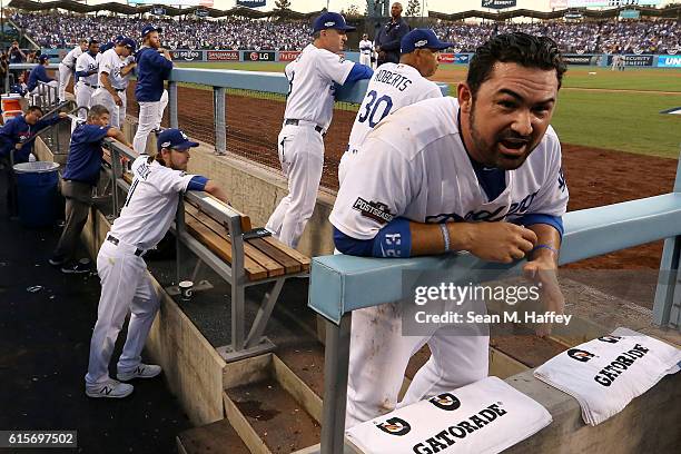 Adrian Gonzalez of the Los Angeles Dodgers reacts in the dugout after being called out on a play at the plate in the second inning against the...