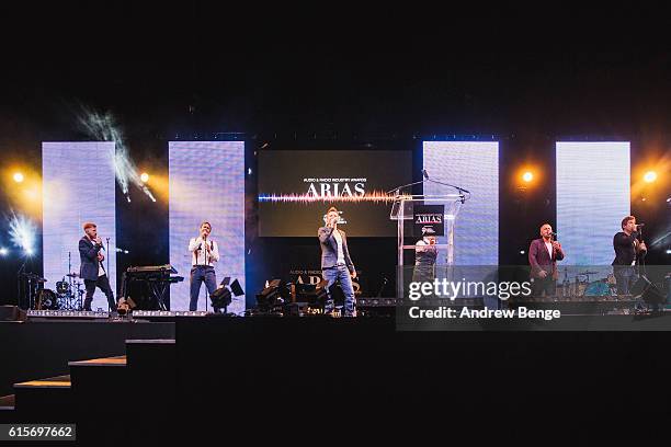 Nicolas Doodson, Michael Welton, Callum McIntosh, Andrew Frost, Stephen Trowell and Fraser Collins of The Magnets performs at the Audio & Radio...