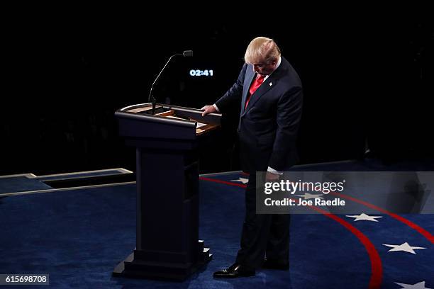 Republican presidential nominee Donald Trump looks down at the podium during the third U.S. Presidential debate at the Thomas & Mack Center on...