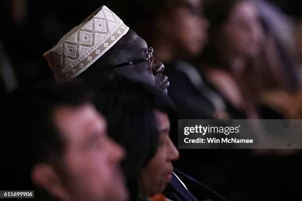 Malik Obama, President Barack Obama's Kenyan-born half-brother, listens to the candidates speak during the third U.S. Presidential debate at the...