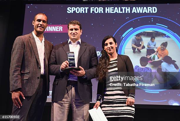 David Cohen of Chalk Talk Group Therapy, Doc Wayne Youth Services collects the Sport for Health award presented by Clarke Carlisle during the Beyond...