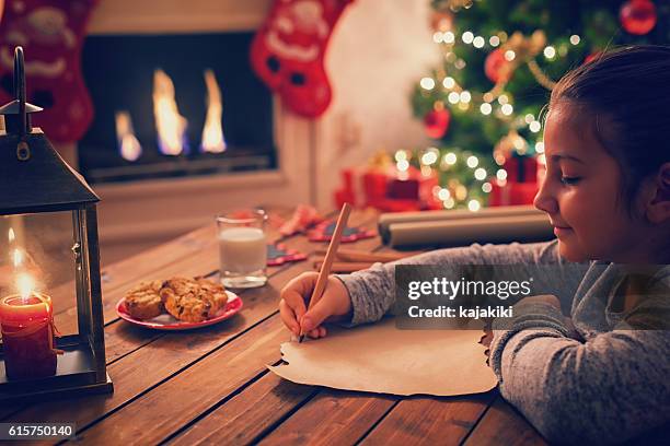 writing to santa claus - wensen stockfoto's en -beelden