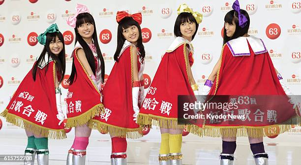 Japan - Members of the J-pop idol group Momoiro Clover Z pose with their special costumes in Tokyo on Nov. 26, 2012. They were among performers...