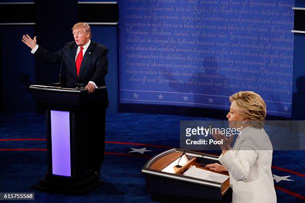 Democratic presidential nominee former Secretary of State Hillary Clinton debates with Republican presidential nominee Donald Trump during the third...