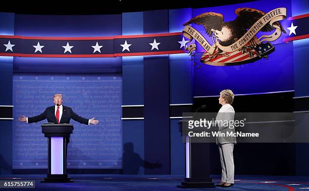 Democratic presidential nominee former Secretary of State Hillary Clinton debates with Republican presidential nominee Donald Trump during the third...