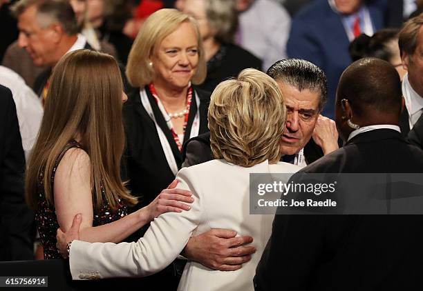 Businessman Haim Saban embraces Democratic presidential nominee former Secretary of State Hillary Clinton after the third U.S. Presidential debate at...