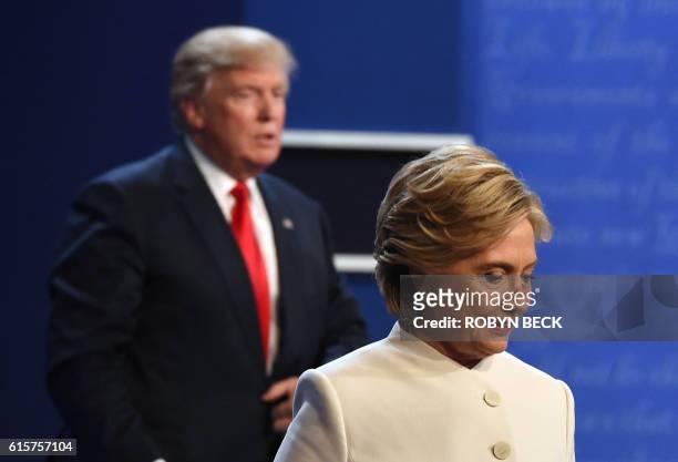 Democratic nominee Hillary Clinton and Republican nominee Donald Trump walk off the stage after the final presidential debate at the Thomas & Mack...