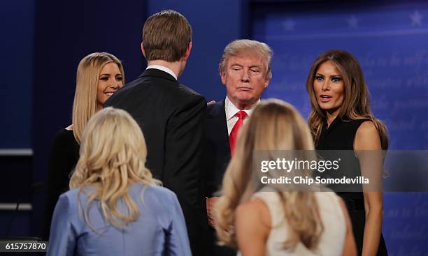 Republican presidential nominee Donald Trump stands on stage with members with his family during the third U.S. Presidential debate at the Thomas &...