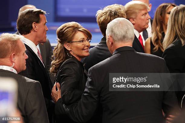 Former Gov. Sarah Palin speaks with Republican vice presidential nominee Mike Pence after the third U.S. Presidential debate at the Thomas & Mack...