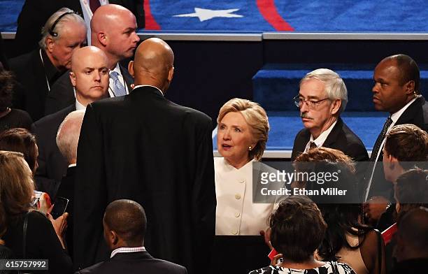 Democratic presidential nominee former Secretary of State Hillary Clinton speaks with former NBA player Kareem Abdul-Jabbar after the third U.S....