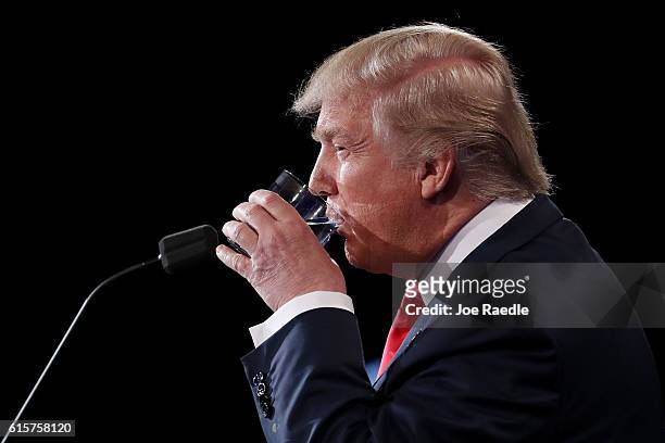 Republican presidential nominee Donald Trump takes a drink of water during the third U.S. Presidential debate at the Thomas & Mack Center on October...